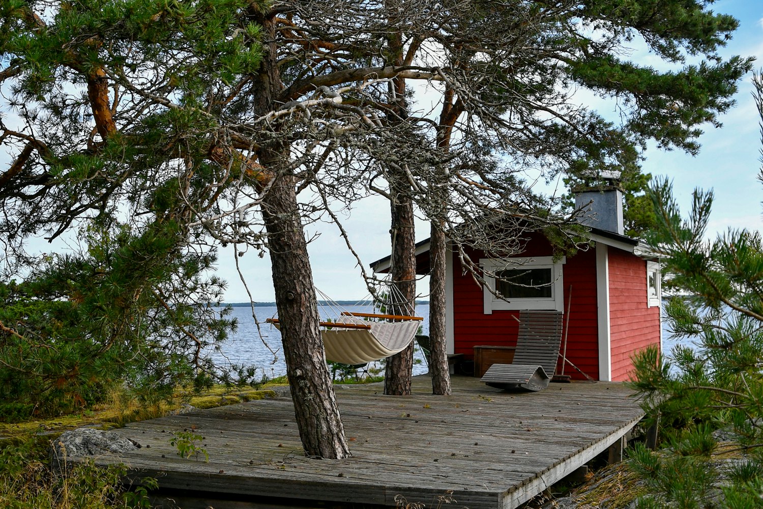 Timber cabin with a hammock looking out to the Kent sea
