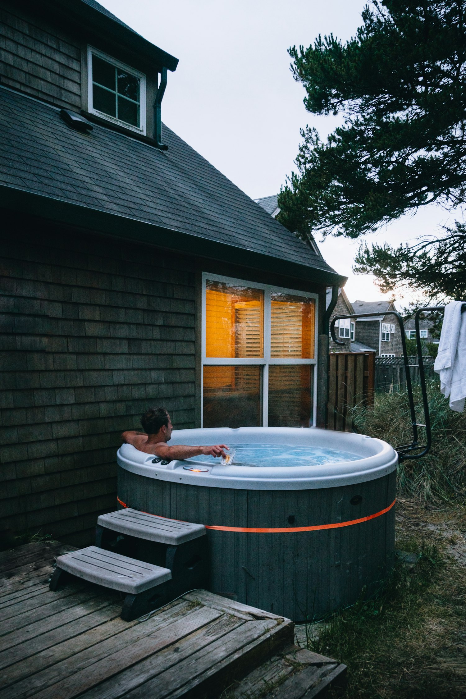 Salt & Sky cabin with hot tub at dusk