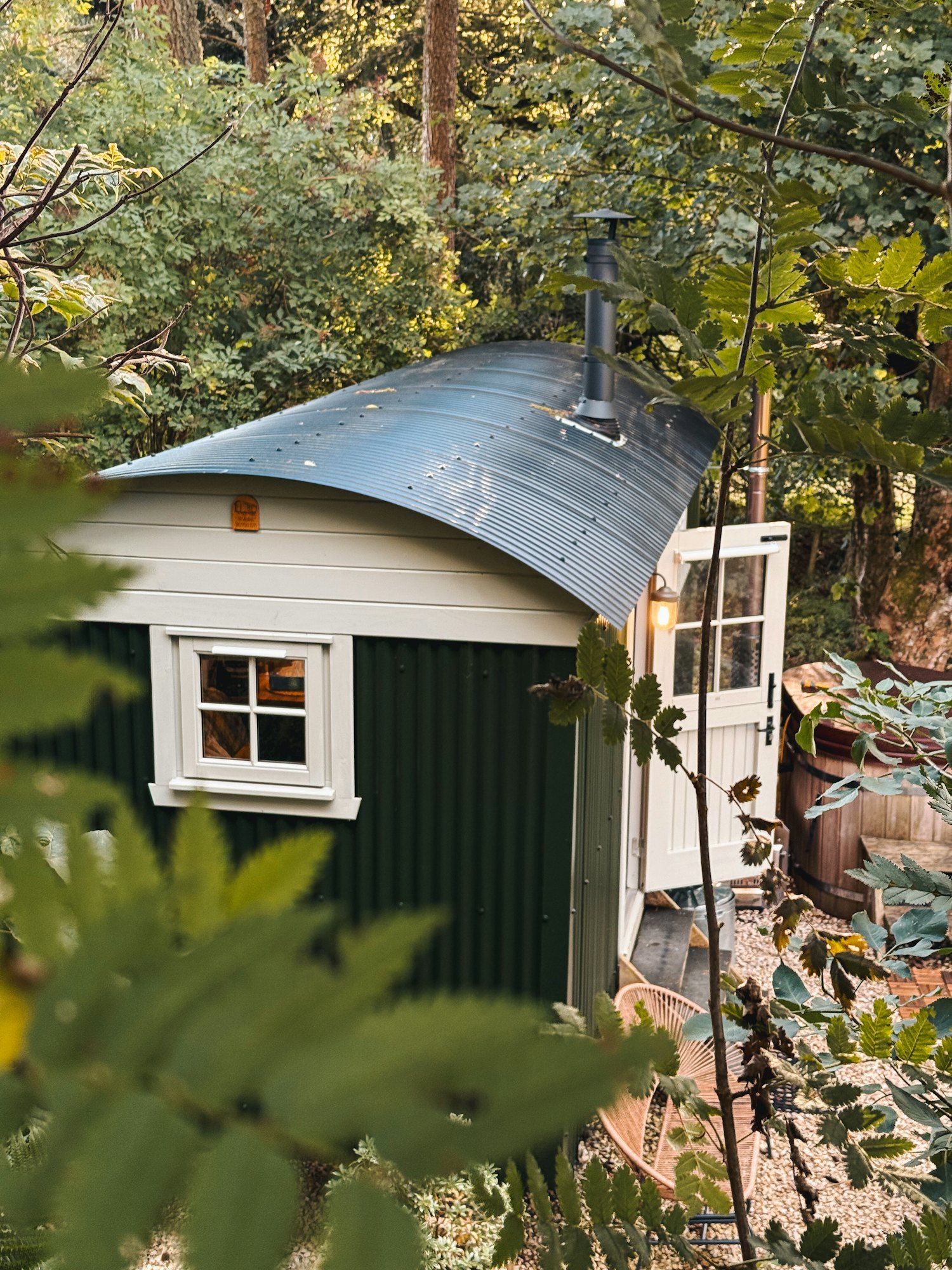 A cosy green shepherd's hut tucked into Kentish woodland